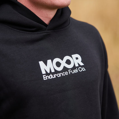 Person wearing a black hoodie with 'MOOR Endurance Fuel Co.' logo.